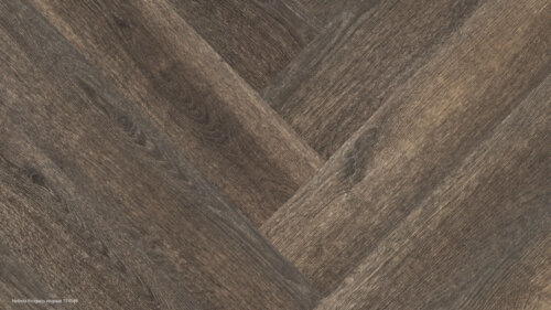 PVC vloer in houten visgraatmotief in warme bruine tint.